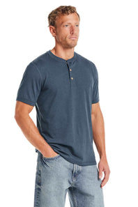 Weatherproof Vintage Jersey Henley Shirt for Men in Cobalt; Man wearing a blue henley shirt and jeans on a white background