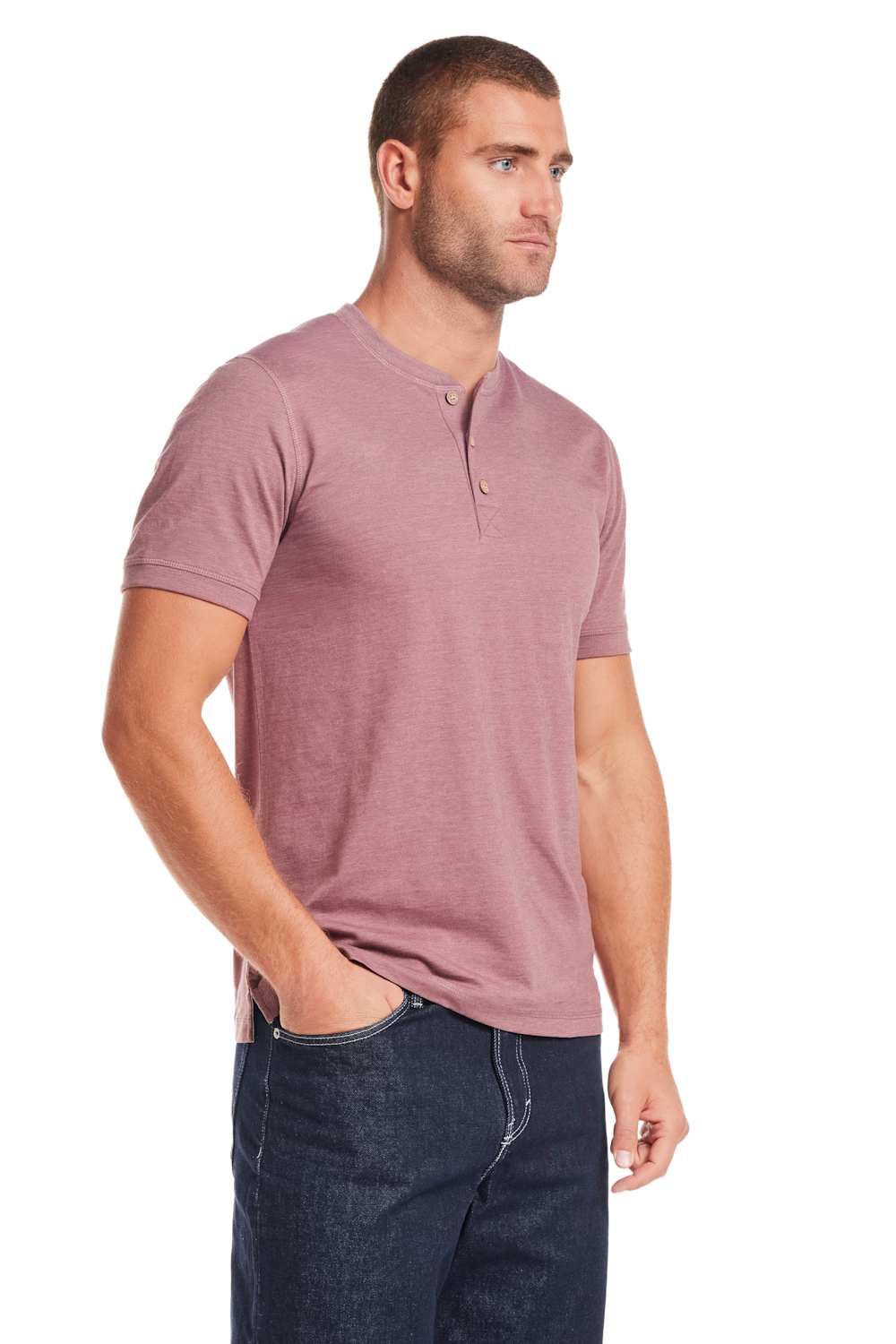 Weatherproof Vintage Jersey Henley Shirt for Men in Rose; Man wearing a mauve henley shirt and dark jeans on a white background
