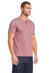 Weatherproof Vintage Jersey Henley Shirt for Men in Rose; Man wearing a mauve henley shirt and dark jeans on a white background