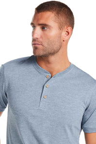 Weatherproof Vintage Jersey Henley Shirt for Men in Spring Wave; Man wearing a blue henley shirt with brown buttons on a white background