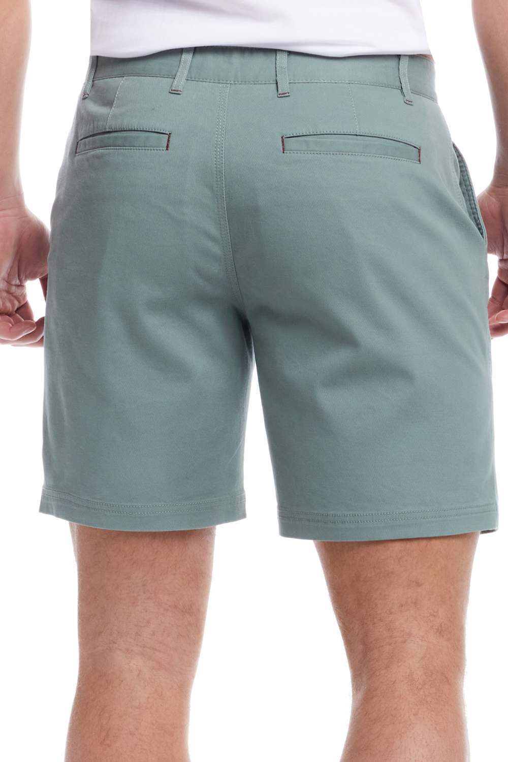 Person wearing light green shorts on a white background