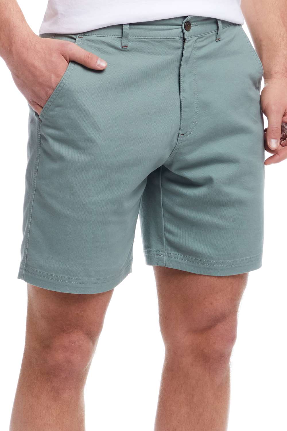 Person wearing light green shorts on a white background