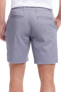 Gray shorts worn by a person on a white background