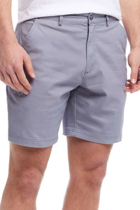Gray shorts worn by a person on a white background