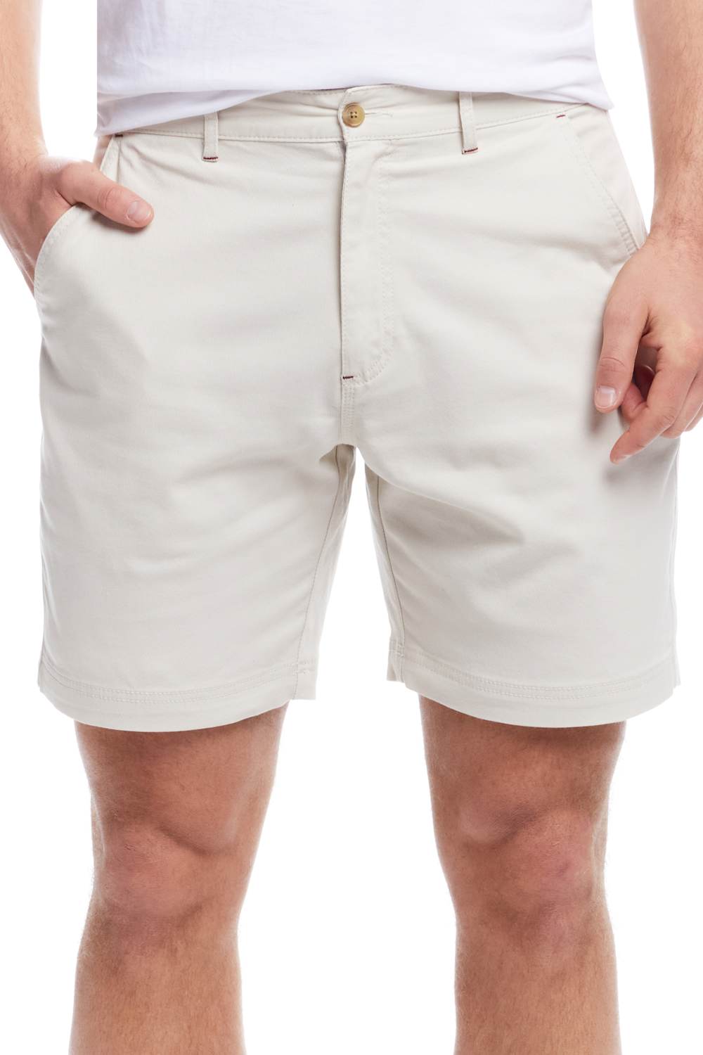 Beige shorts worn by a person on a white background
