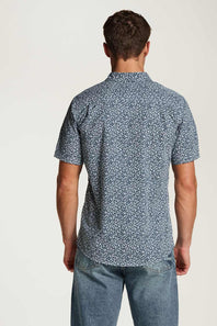 Weatherproof Vintage Poplin Button Up Shirt for Men in Teal; Man wearing a blue patterned shirt and jeans on a white background