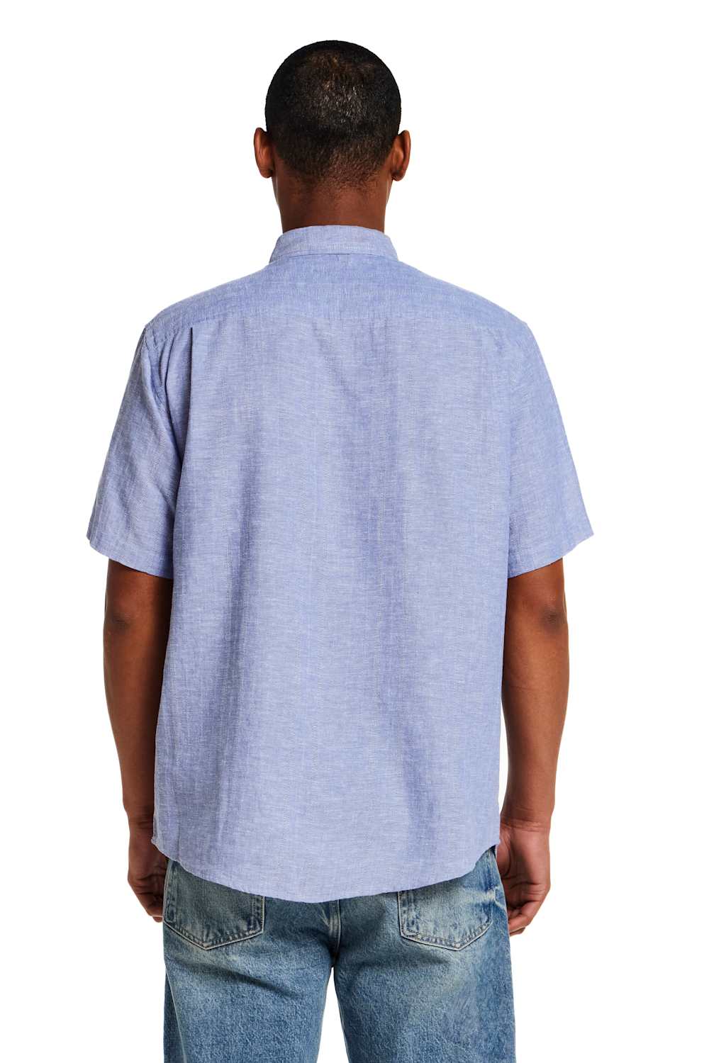 Weatherproof Vintage Cotton Linen Stripe Button Down Shirt for Men in Infinity Blue; Person wearing a light blue short-sleeve shirt and jeans on a white background