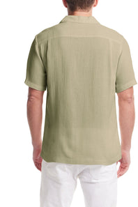 Weatherproof Vintage Cotton Airtex Shirt for Men in Seagrass; Man wearing a green short-sleeve shirt on a white background