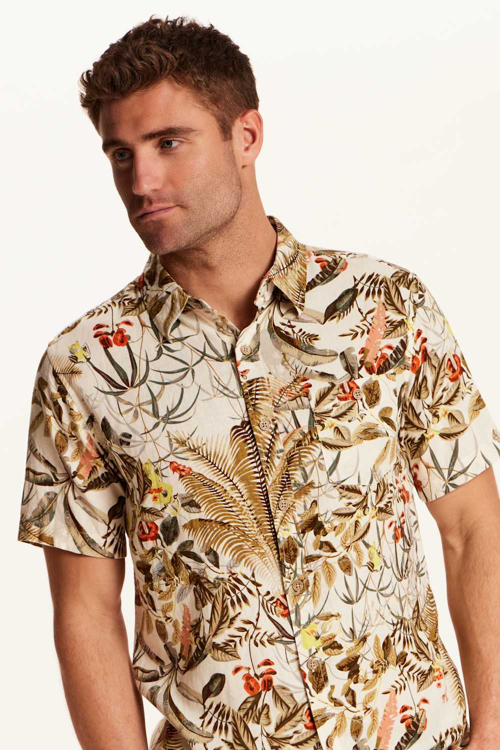Weatherproof Vintage Camp Collar Printed Shirt for Men in Wheat; Man wearing a patterned shirt with nature design on a plain background