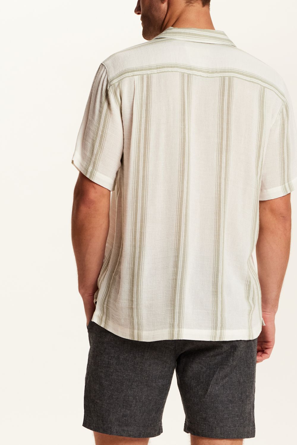 Weatherproof Vintage Striped Cotton Airtex Shirt for Men in Seagrass; Person wearing a beige striped shirt and dark shorts on a white background