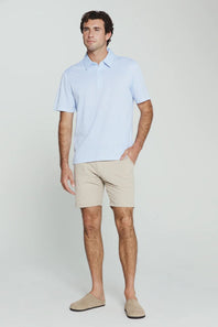 7Diamonds Aires Polo for Men in Light Blue; Man wearing a light blue polo shirt and beige shorts on a white background
