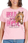 A woman wearing a light pink graphic T-shirt with the words 'HOLD ON TO HOPE' in pink lettering, a brown horse illustration, and 'simply southern' printed below. The photo is cropped from the mouth down to the hips, showing the fit of the shirt.