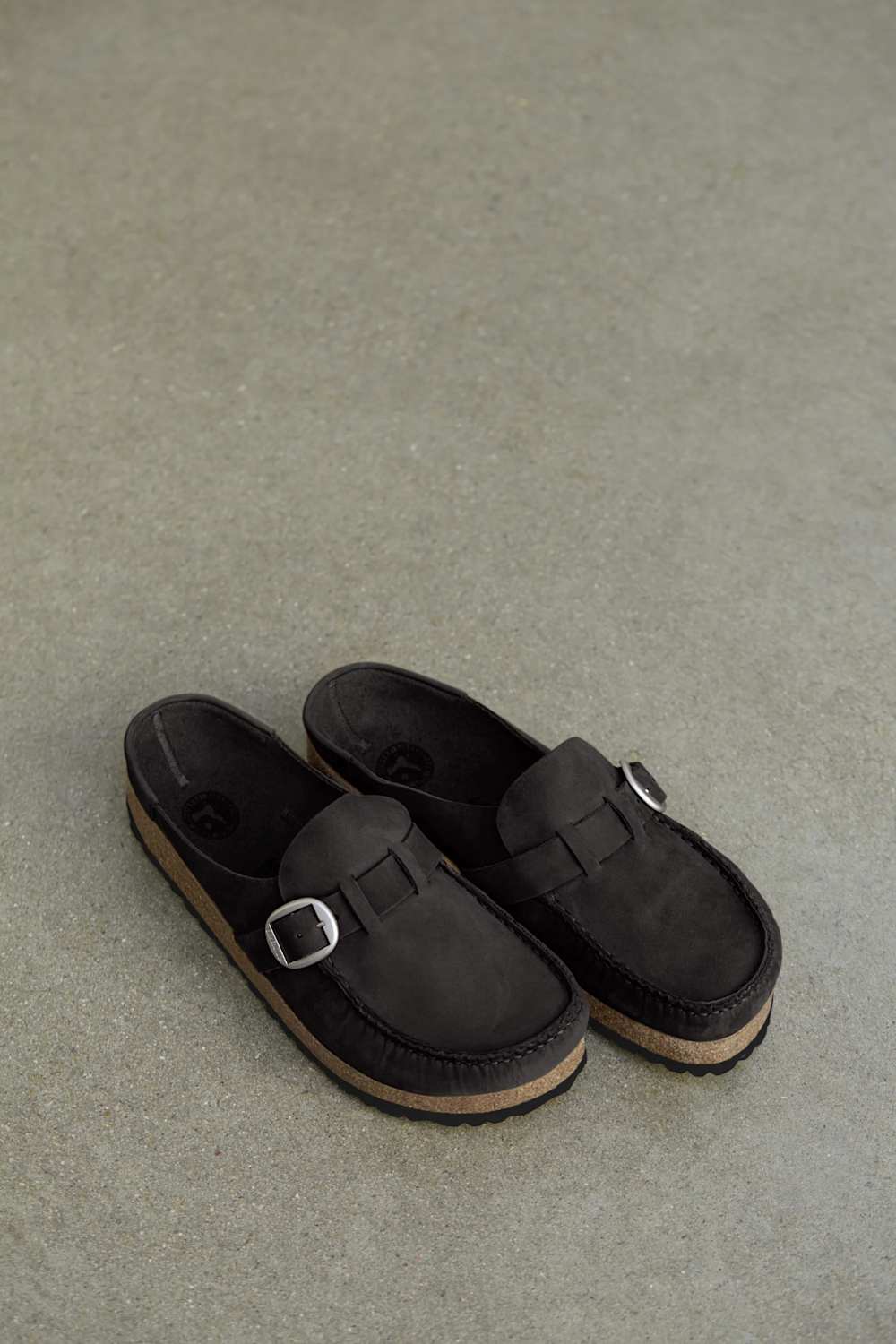 Leather clog style mule with a silver buckle and cork sole