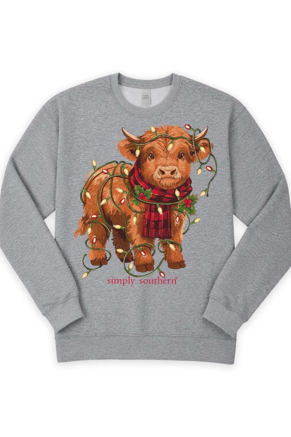 A heather gray crewneck sweatshirt featuring a graphic of a brown Scottish Highland cow wearing a red plaid scarf and holiday string lights, with the text 'simply southern' printed below.