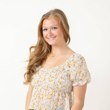 Illa Illa Smocked Flowy Floral Printed Woven Top for Women in Off White Multi
