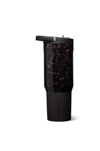 A tall travel tumbler with a black base and a tortoiseshell-patterned upper section, featuring a black flip-top lid, shown on a plain white background.