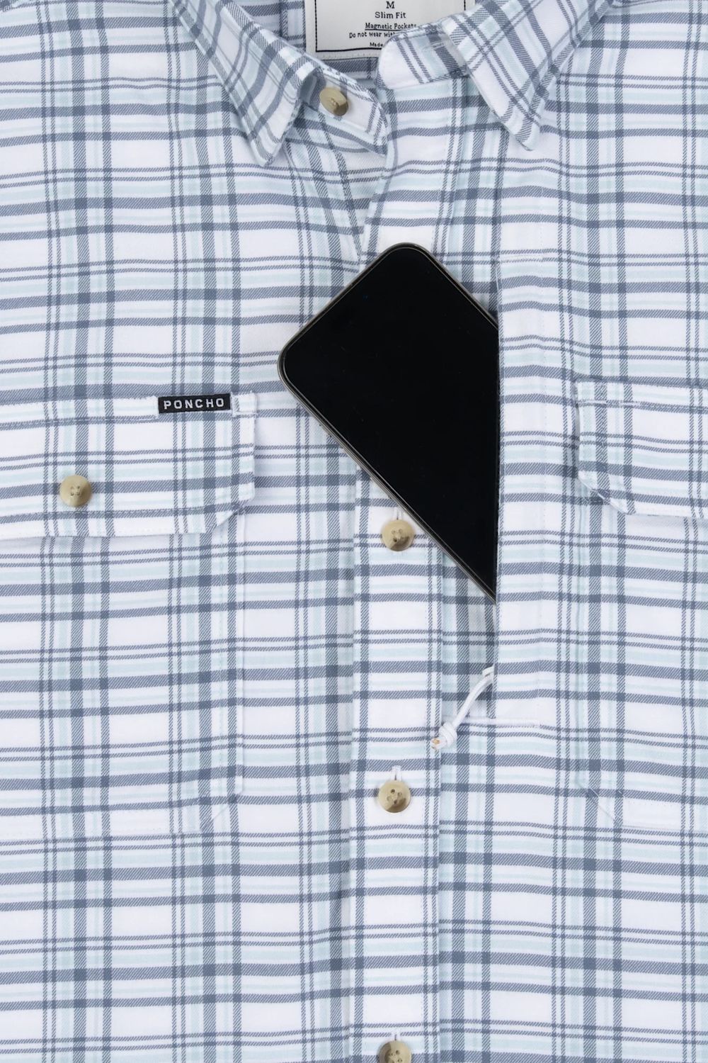 Close-up of a white and light blue plaid button-down shirt with a chest pocket, gold-tone buttons, and a black pouch pocket holding a black smartphone. The brand label on the pocket reads PONCHO.