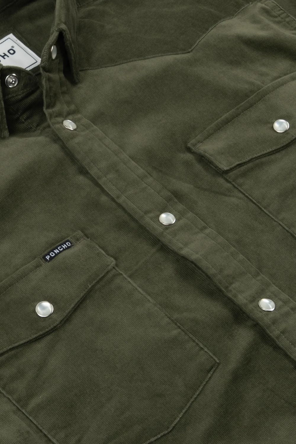 Close-up of an olive green button-up shirt jacket with silver snap buttons, chest flap pockets, and a small black brand tab reading PONDIO.