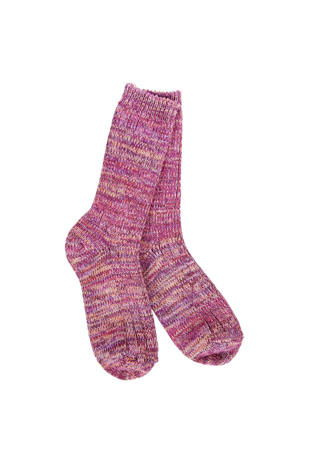 A pair of hand-knit crew socks in a marled pink, purple, and orange yarn, shown against a plain white background.