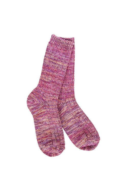 A pair of hand-knit crew socks in a marled pink, purple, and orange yarn, shown against a plain white background.