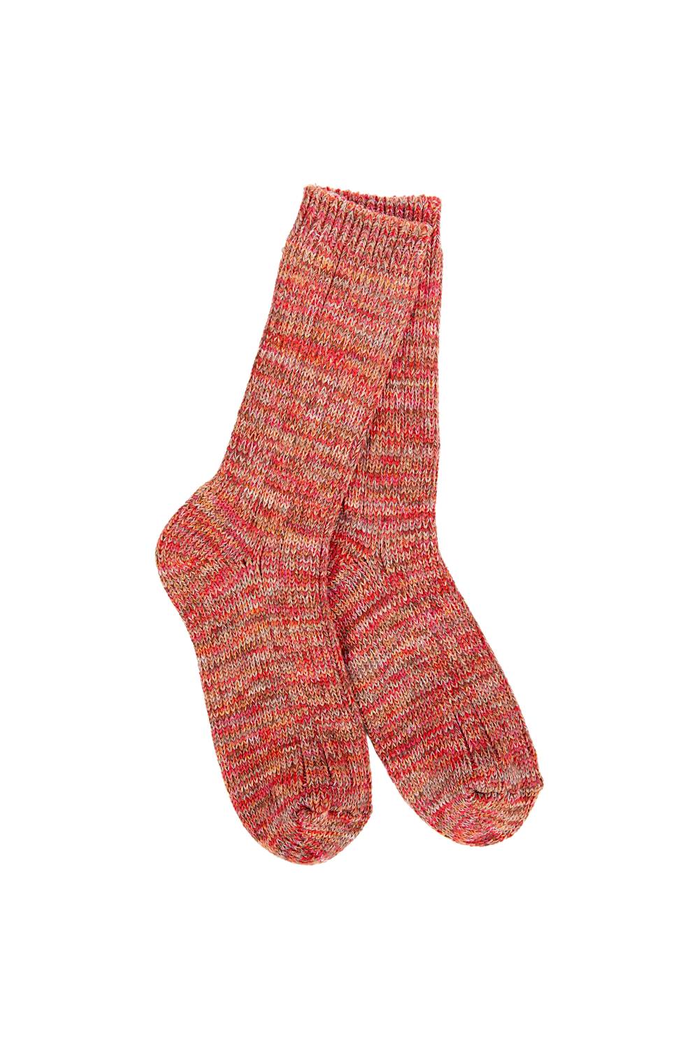A pair of hand-knit crew socks in a heathered marled pattern of red, orange, and beige yarn, shown against a plain white background.