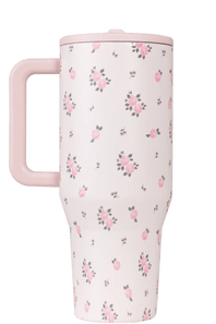 Floral-patterned tumbler with pink handle on a transparent background
