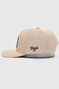 A beige baseball cap with perforated side panels, featuring the word 'Waggle' embroidered in black script on the front side. The cap is shown in profile against a light gray background.