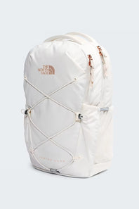 White backpack with decorative strings on a light gray background