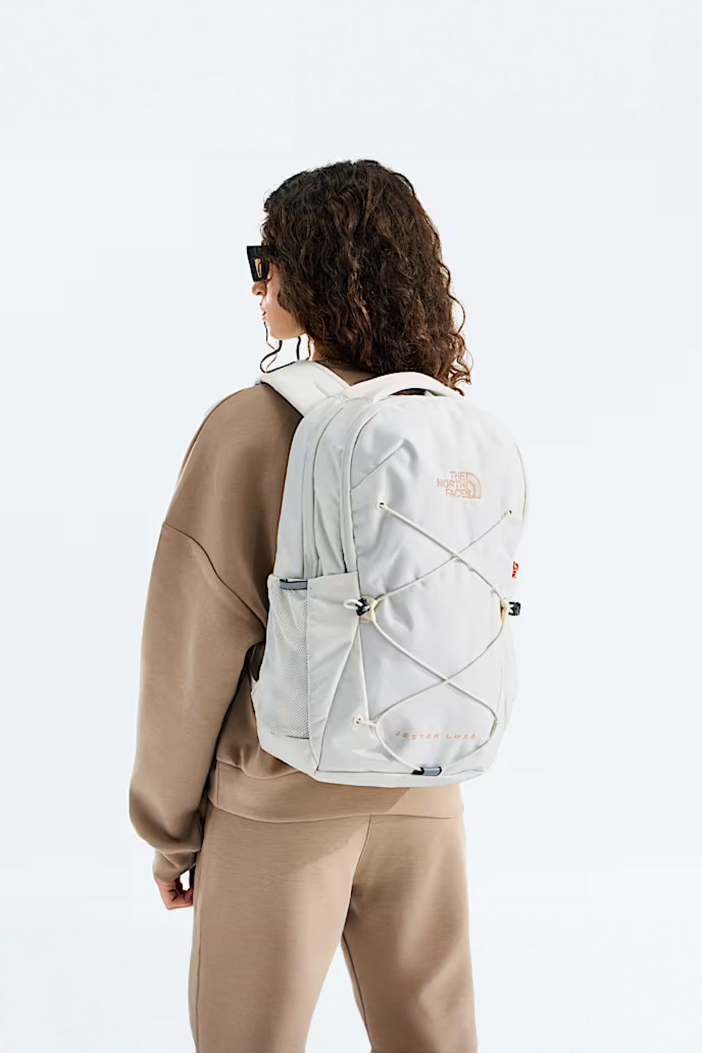 The North Face Women's Jester Luxe Backpack, White Dune/Burnt Coral Metallic