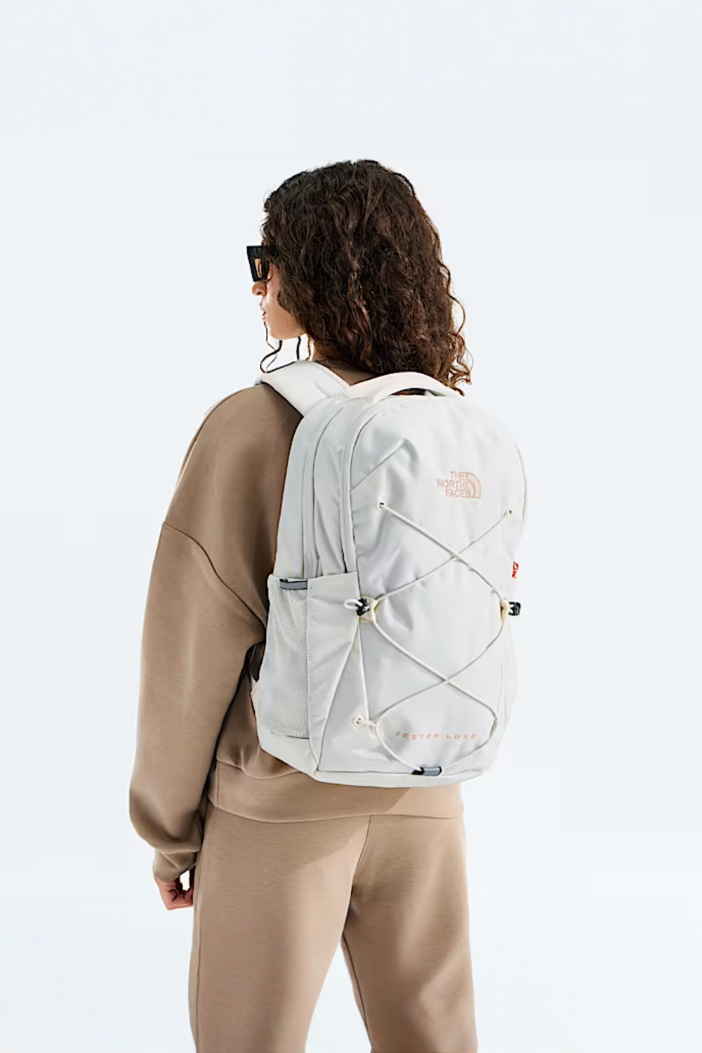 White TNF backpack with rose gold metallic details 