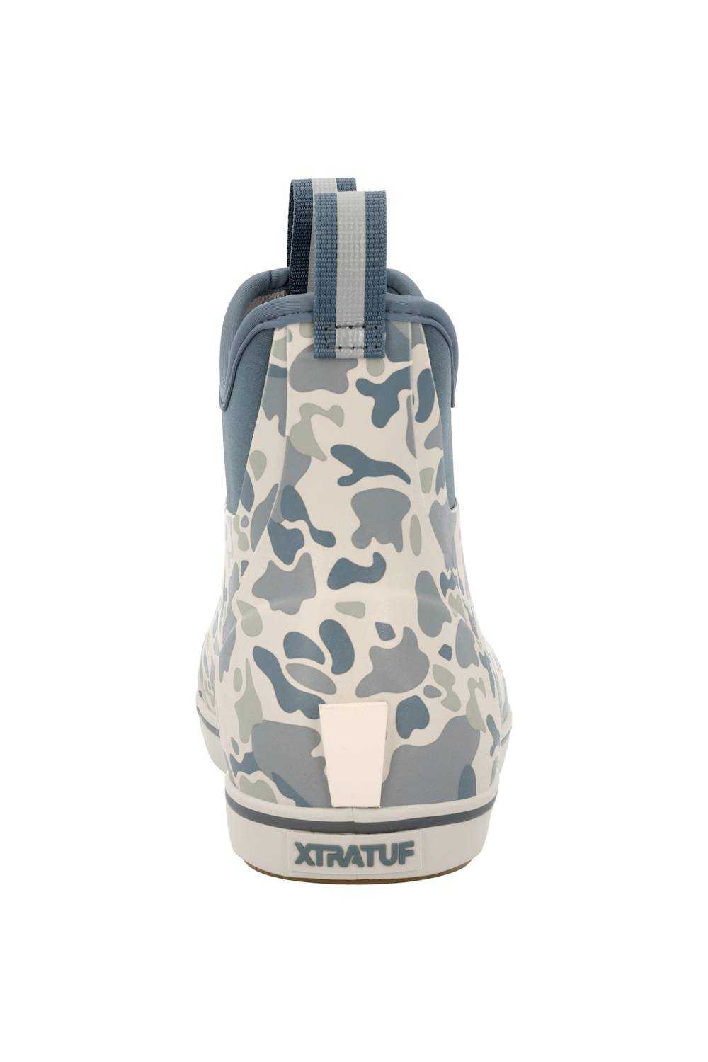 A single XtratuF ankle rain boot shown from the back, featuring a blue and gray camouflage pattern on a white base, with a blue pull tab and a white sole.