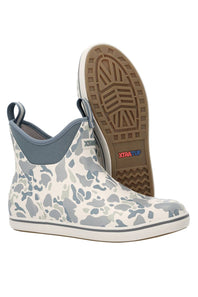 A pair of low-cut rubber boots with a gray and white camouflage pattern, shown with one boot standing upright to display the brown XtraTurf sole.