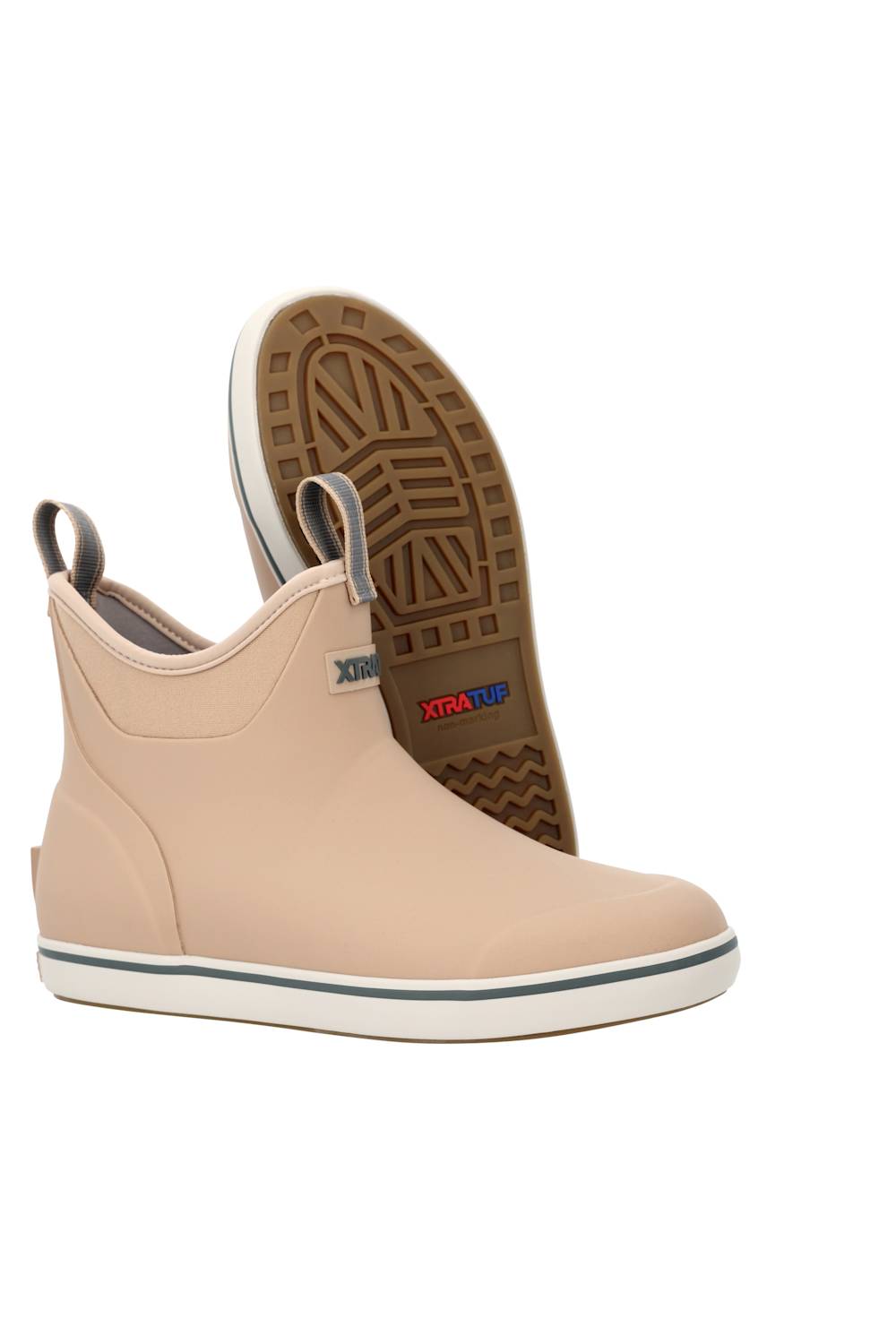 A pair of beige rubber water shoes with white soles, shown on a plain white background. One shoe is upright, showing its side profile, while the other is turned upside down to display the brown textured outsole.