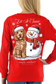 A woman wearing a bright red long-sleeve shirt, viewed from the back. The shirt features a large graphic print of a brown curly-haired dog and a snowman wearing Santa hats and a red scarf, with the text 'Let It Snow' and 'simply southern' collection'.