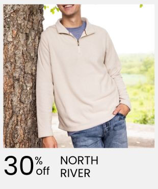 A man wearing a light beige quarter-zip long-sleeve pullover and blue jeans, standing next to a tree outdoors. A white banner at the bottom features the text '30% off NORTH RIVER'.