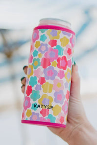 A can cooler with a colorful floral pattern in pink, yellow, teal, and purple, featuring the brand name KATYDID near the bottom.