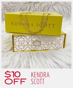 Two yellow Kendra Scott boxes with a gold necklace laying on the top box on a fur like background with a promotional banner at the bottom that reads '$10 OFF KENDRA SCOTT'