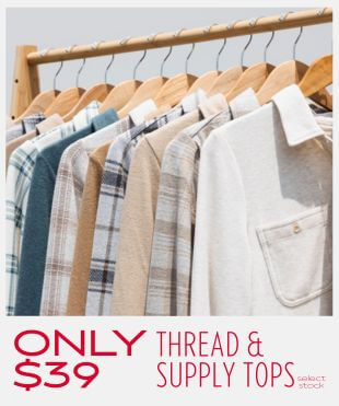Multiple different women's button up tops hanging on a wooden clothing rack with a promotional banner at the bottom that reads 'Only $39 Thread & Supply Tops' fine print reads select stock