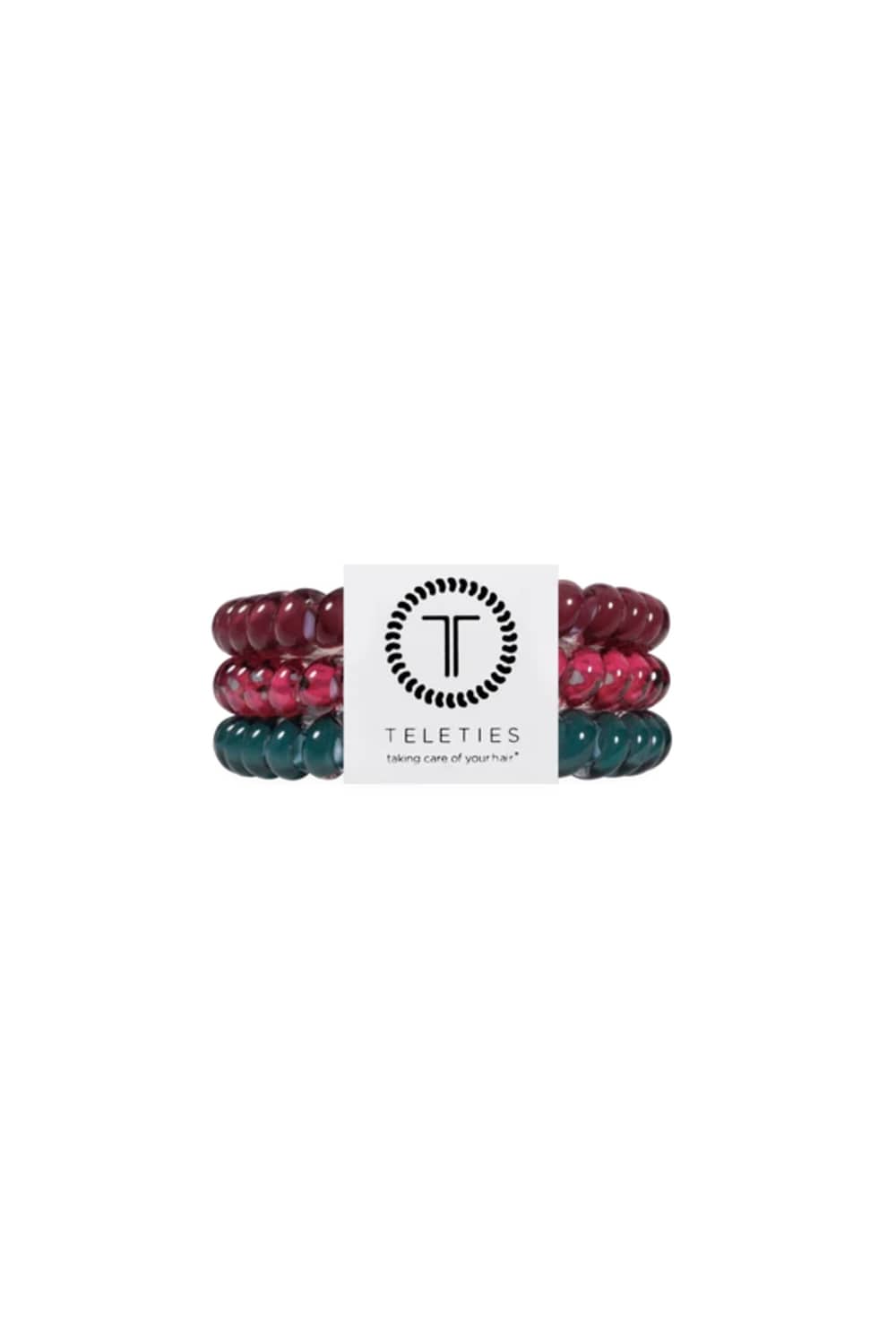 Three beaded stretch hair ties stacked together on a white background, featuring glossy dark teal, translucent pink with silver flecks, and deep burgundy beads.