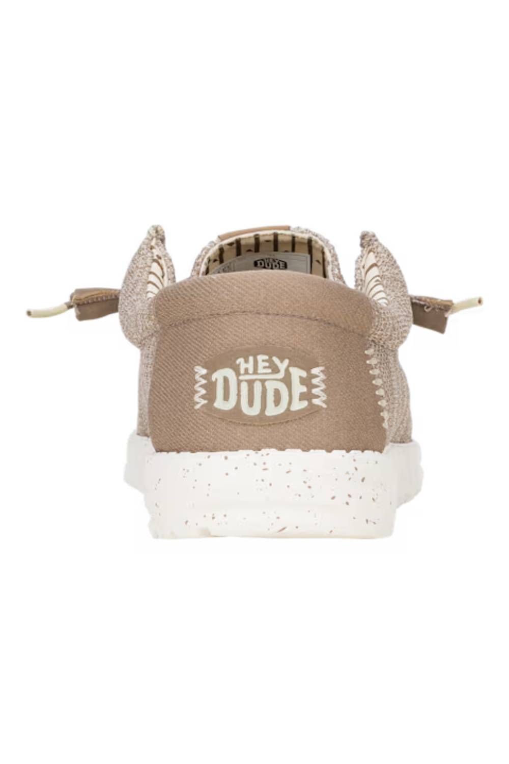 A single low-top sneaker shown from the back on a white background. The shoe features a beige canvas heel panel with 'HEY DUDE' printed in white, a textured knit upper, and a speckled white midsole.