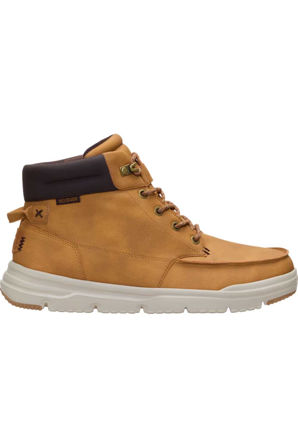A mid-top casual boot in tan suede with a dark brown collar, brown laces, and a thick white sole, shown from a side profile on a white background.