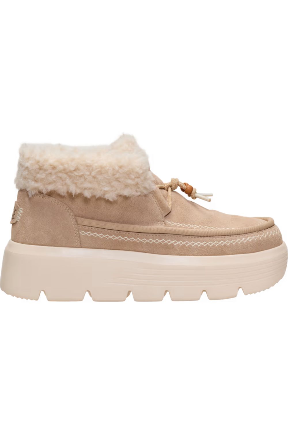 A beige suede ankle boot with a fluffy cream faux-fur collar and a chunky cream platform sole, shown from a side profile on a white background.