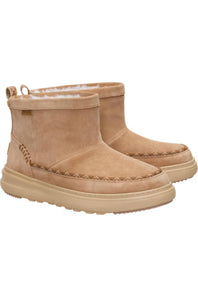 A pair of beige suede ankle boots with thick beige soles and decorative stitching, shown against a plain white background.