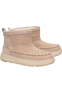 A pair of beige suede ankle boots with cream-colored soles and a decorative zigzag stitch detail around the midsole, shown against a plain white background.