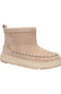 A single ankle suede boot in a light beige or taupe color, featuring a thick cream-colored sole and decorative stitching along the vamp, shown against a plain white background.