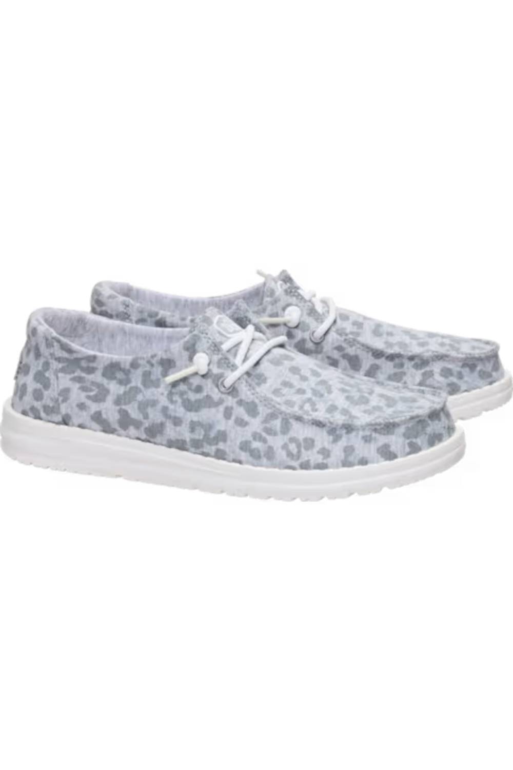 A pair of slip-on casual shoes with a gray and white leopard print pattern, white laces, and white soles, shown against a plain white background.