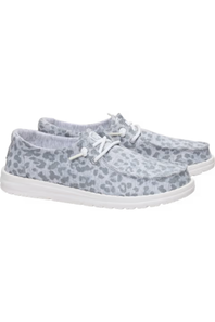 A pair of slip-on casual shoes with a gray and white leopard print pattern and white laces, shown against a plain white background.
