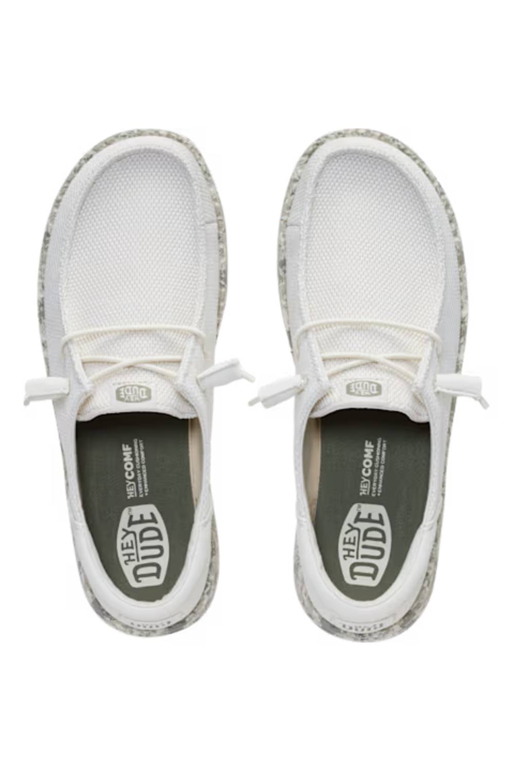 A pair of white slip-on mesh sneakers with textured gray and white patterned soles, shown from a top-down view on a white background.