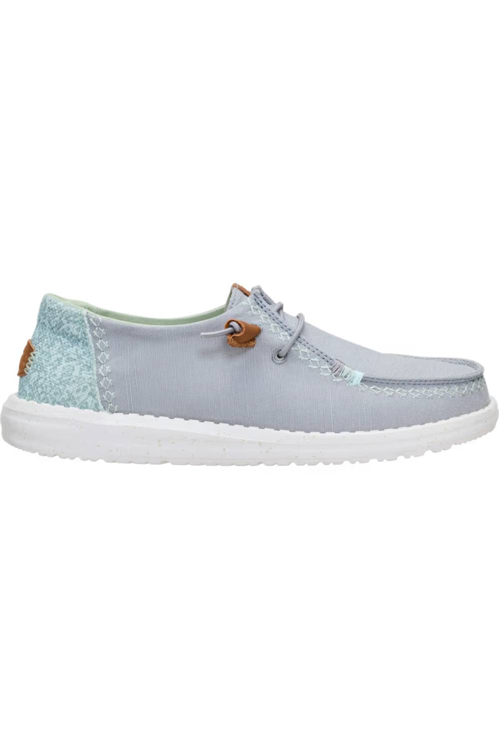 A light blue suede boat shoe with a textured light blue heel panel, white sole, and a small brown leather detail on the side.