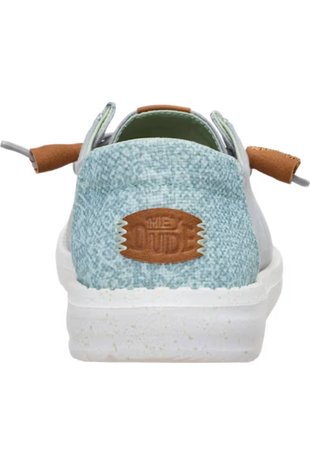 A close-up rear view of a low-top shoe with a light blue textured fabric upper, a brown leather patch 
